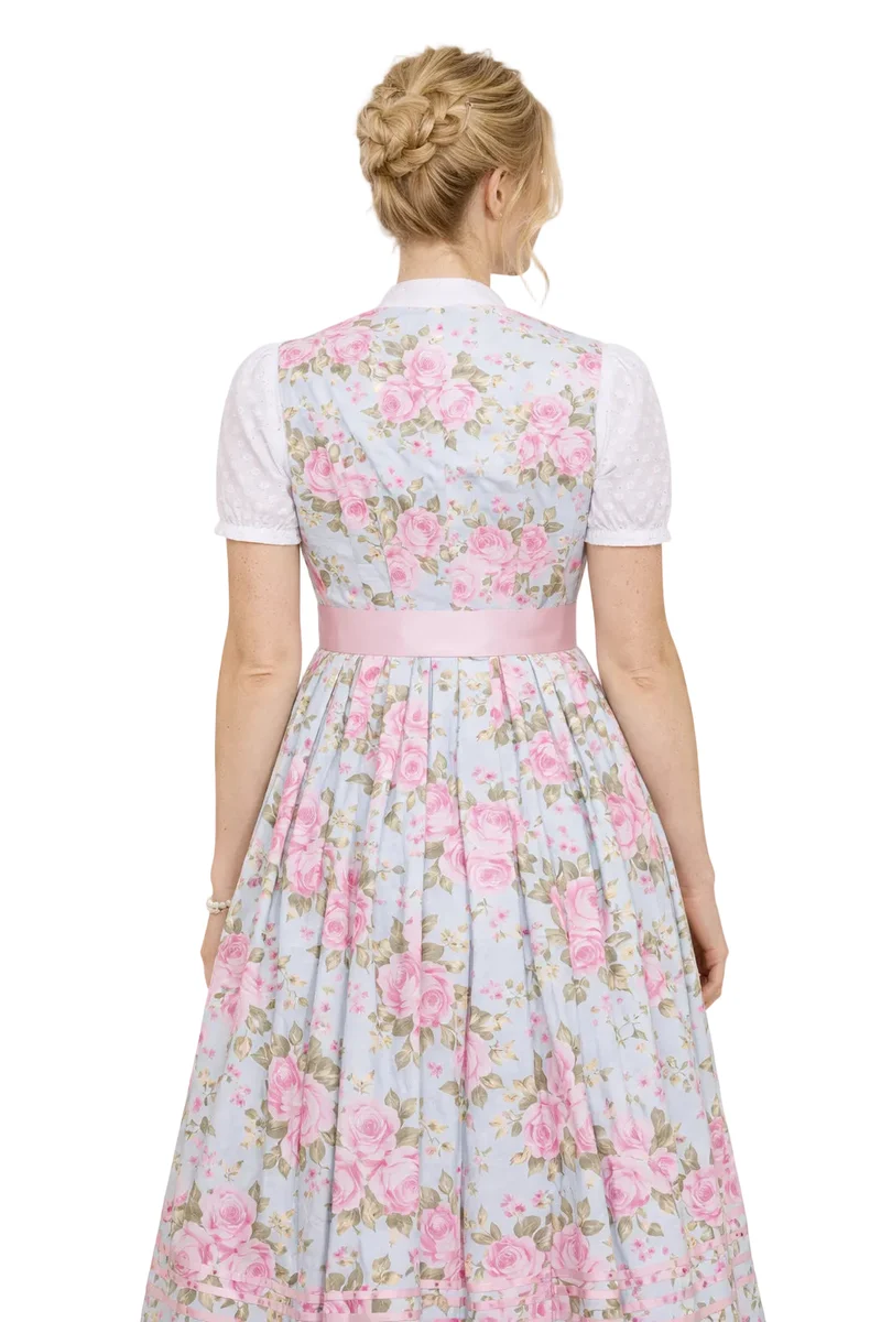 Dirndl aus Rosendruck mit aufgesetzten Bändern