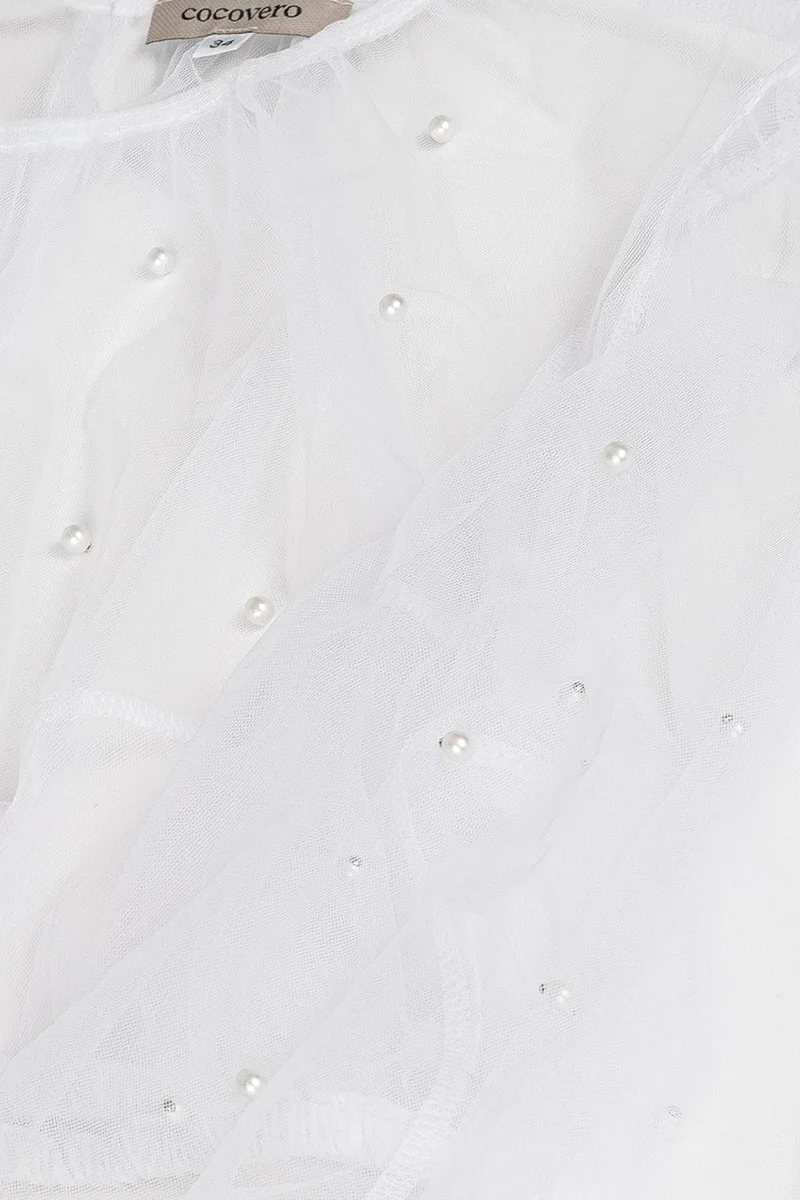 Dirndlbluse aus transparentem Tüll mit Perlen